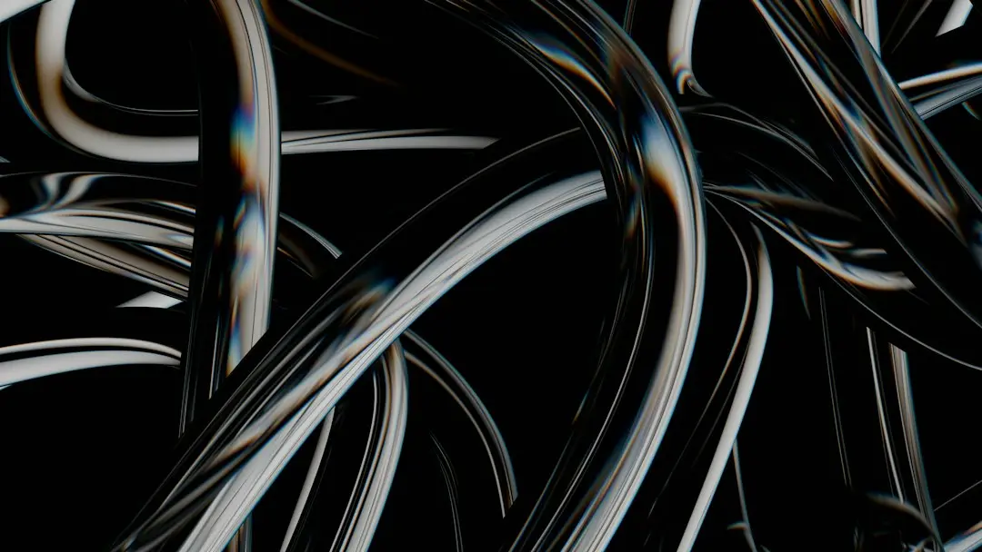 Abstract glossy tubes tangled on a black background, like the cables Drogon TV replaces with an internet connection